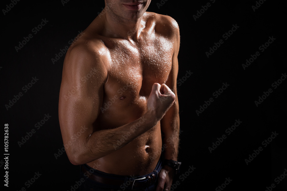 Strong and sexy man showing his biceps Strong and sexy man showing his biceps