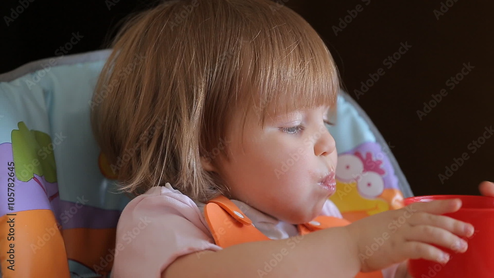 Hand With Spoon Feeding Cute Lovely Baby Girl Hand With Spoon Feeding Cute Lovely Baby Girl