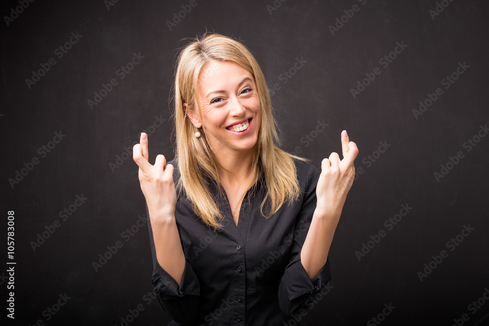 Woman with her fingers crossed Woman with her fingers crossed