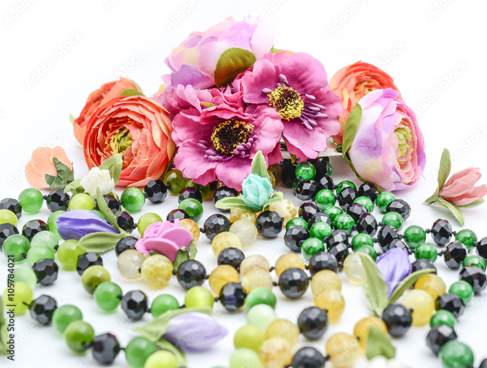 Fototapeta premium beads and flowers on white