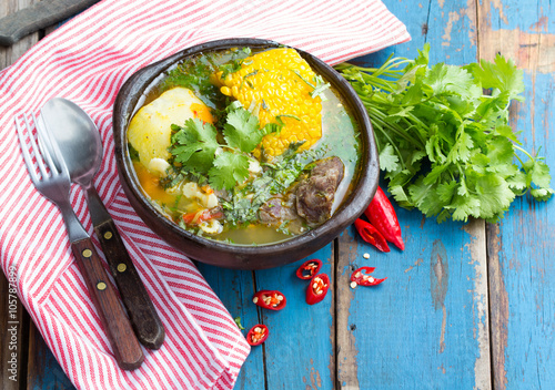 Latin american food. Cazuela - traditional chilean soup served in clay plate from pomaire photo