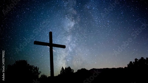 Milky Way stars moving behind a cross