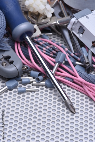 Electrical tools, component and cables on metal surface