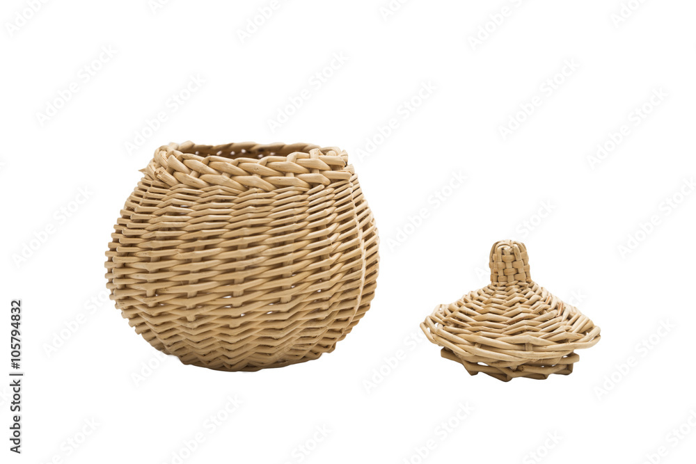 Wicker round vessel with a lid on isolated background
