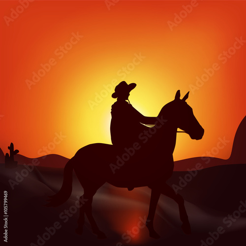 Cowboy on sunset background