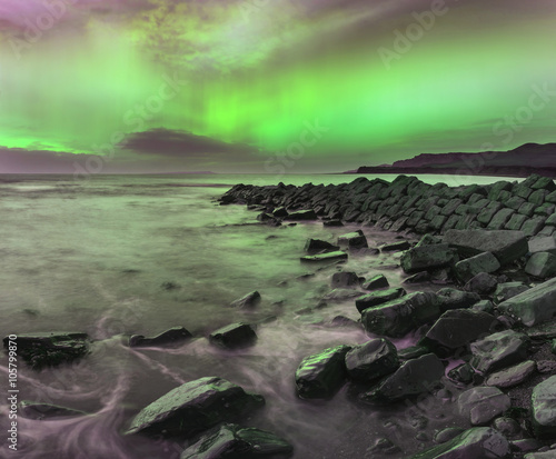 Beautiful Northern Lights Aurora Borealis over coastal landscape © veneratio