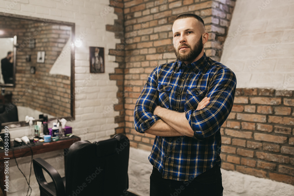Bearded hipster client visiting barber shop Bearded hipster client visiting barber shop