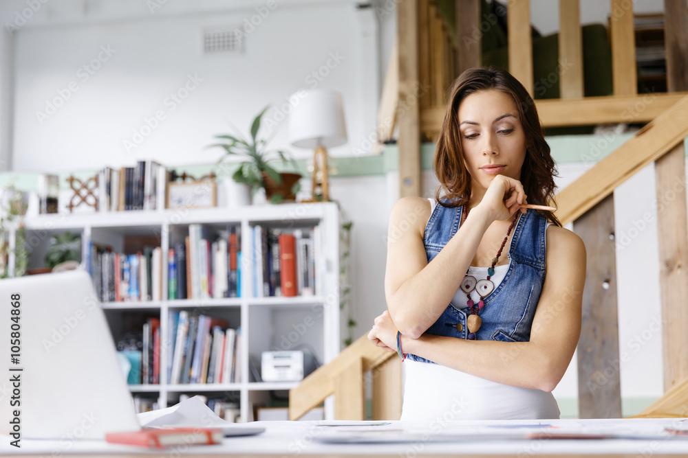 Young woman standing in creative office Young woman standing in creative office