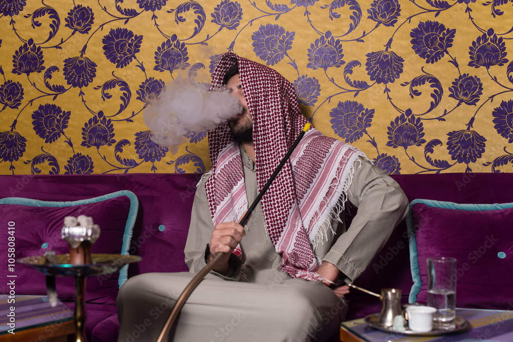 Islamic Man Smoking Shisha In The Arabic Cafe Stock 写真 Adobe Stock