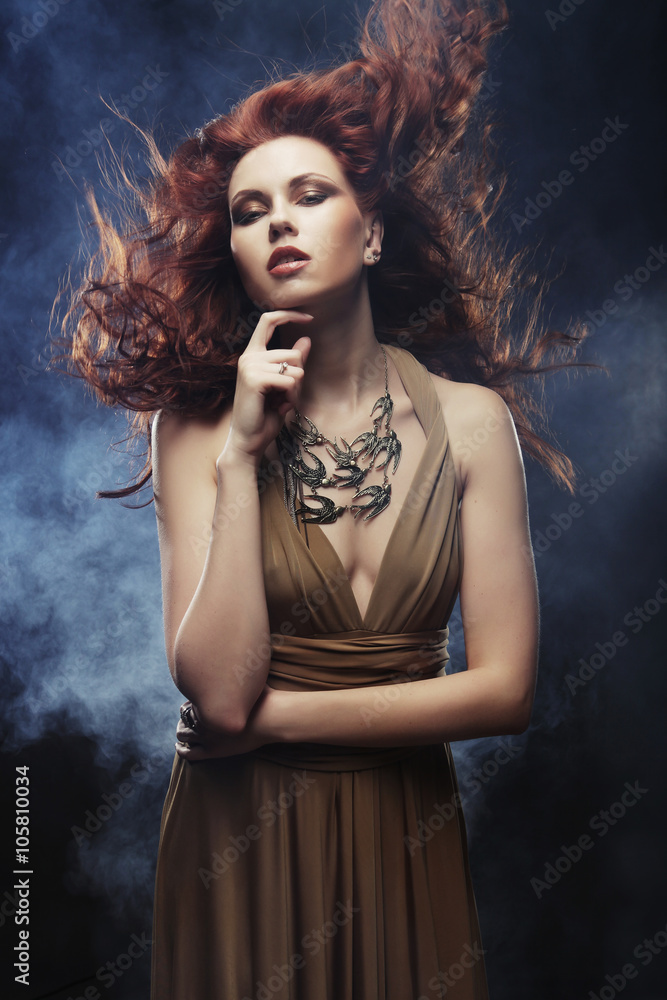 woman with bright red curly hair woman with bright red curly hair