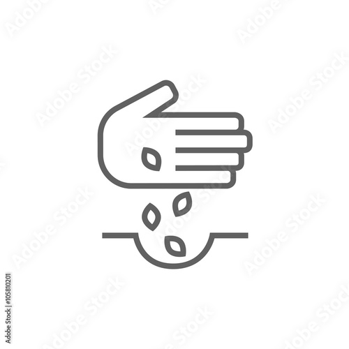 Hand planting seeds in ground line icon.