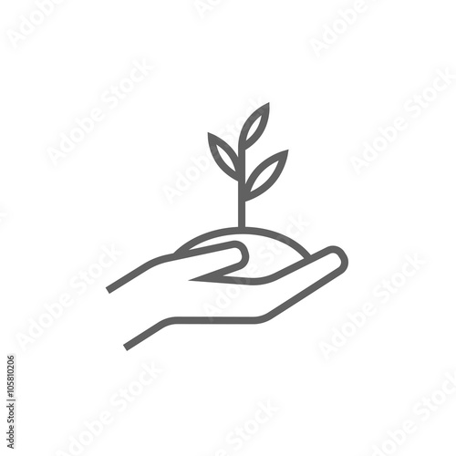 Hands holding seedling in soil line icon.