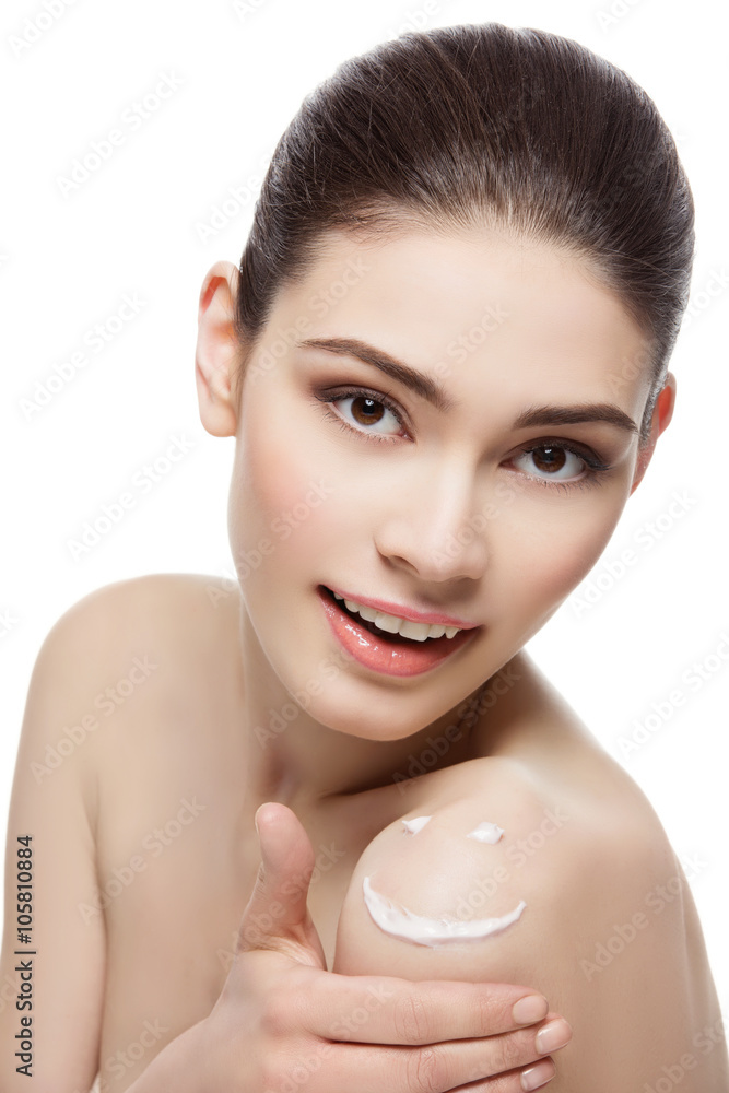 Girl with cream smiley face on shoulder Girl with cream smiley face on shoulder