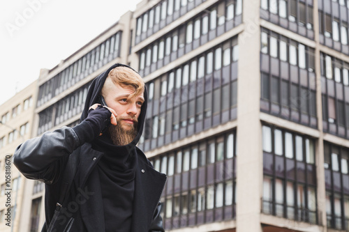 Stylish bearded man talking on phone