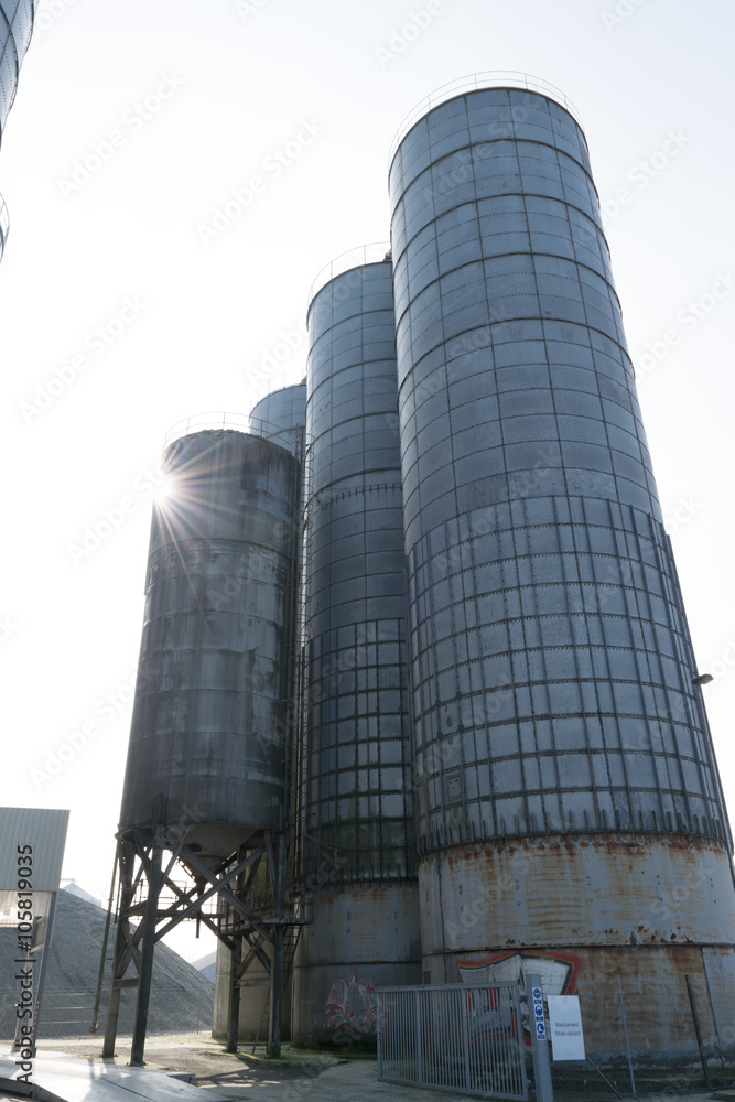 Old steel silos with white cement
