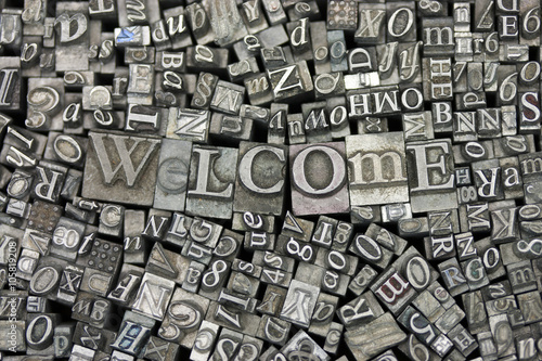 Canvas Print Close up of typeset letters with the word Welcome