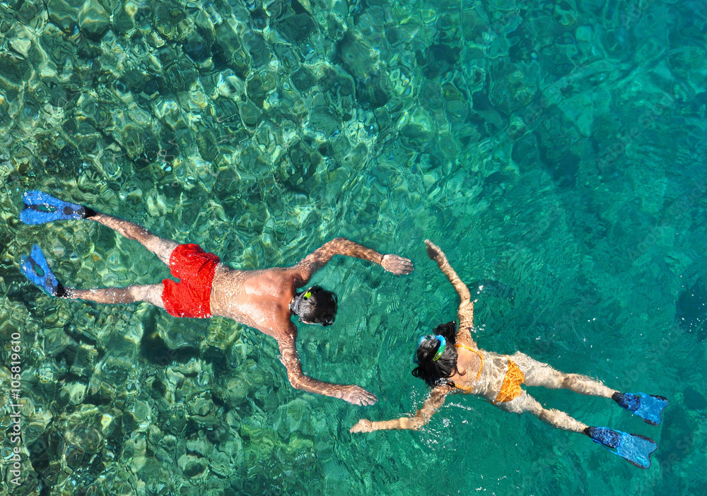 Romantic couple snorkeling in the sea