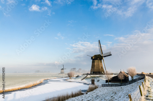 Dutch windmill in the winter photo