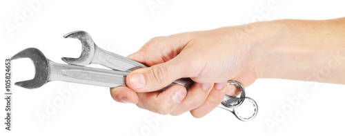 A hand of repairman holding wrenches, on white background, close-up