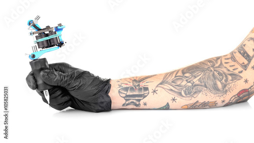 Tattooist hand in black glove with tattoo machine isolated on white background, close up