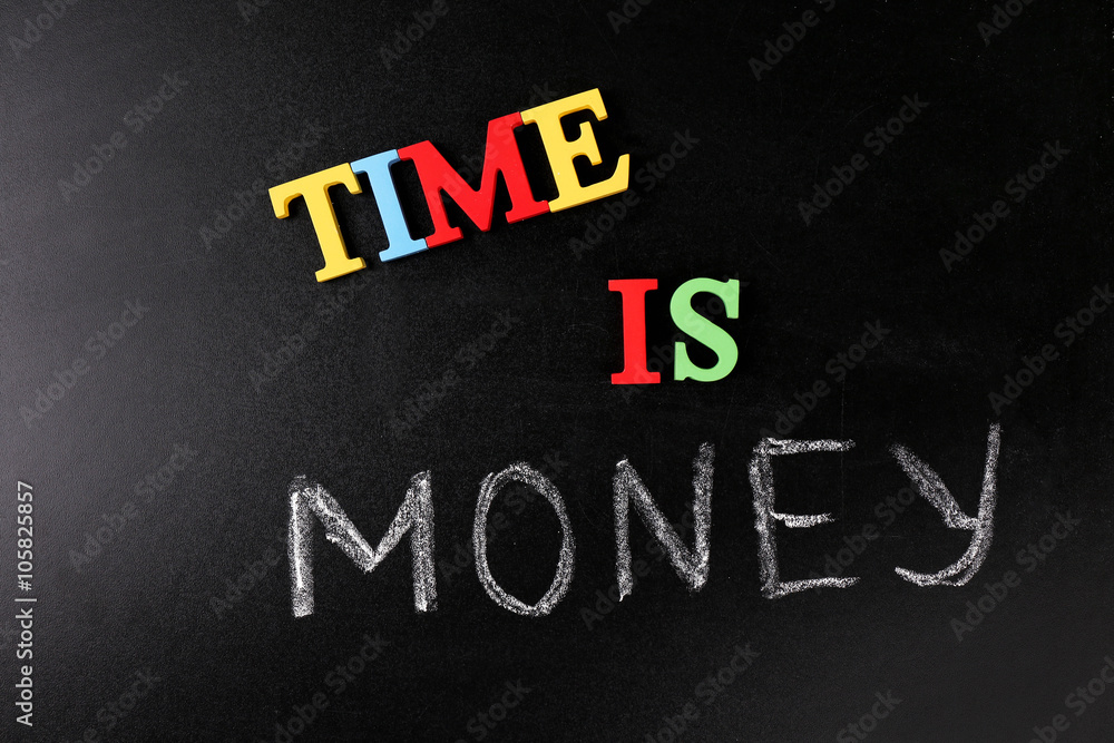 Fototapeta premium Time is money concept on a blackboard background