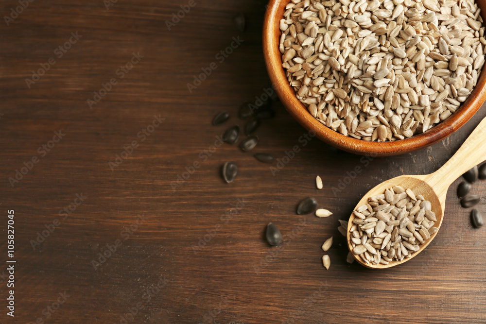 Peeled sunflower seeds on wooden table background, closeup Peeled sunflower seeds on wooden table background, closeup