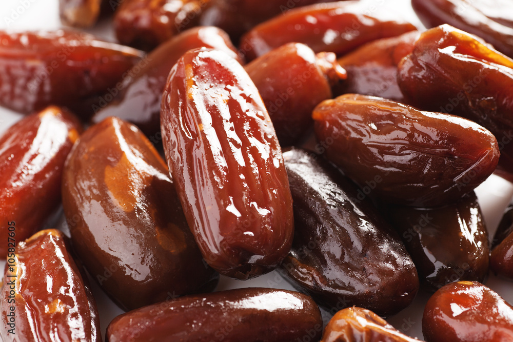 Dried dates in a white plate closeup Dried dates in a white plate closeup