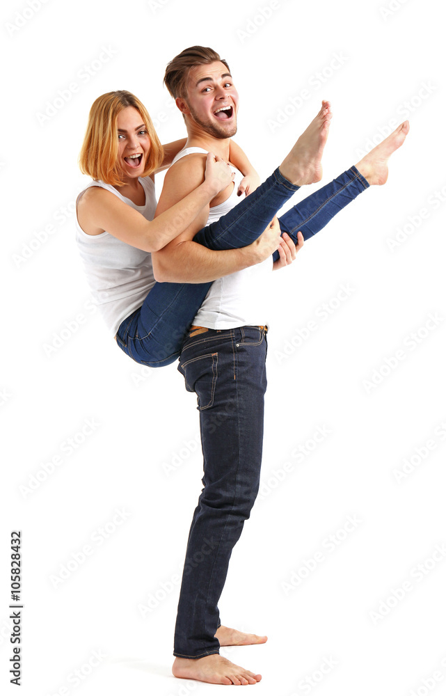 Young couple in love having fun together, isolated on white Young couple in love having fun together, isolated on white