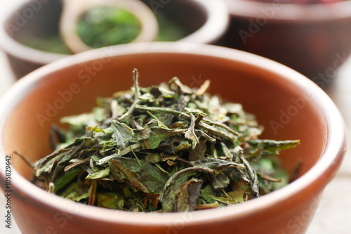 White tea in a wooden bowl  close up