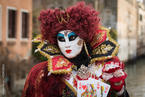 Venice - February 6, 2016: Colourful carnival mask through the streets of Venice and in St. Mark's Square during celebration of the most famous carnival in the world. 