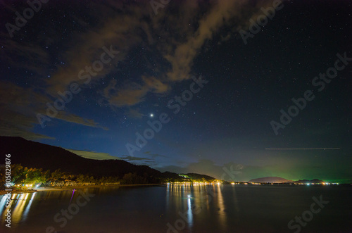 Star and comet in the sky at the Khanom beach of Thailand, Nakhon Si Thammarat province.