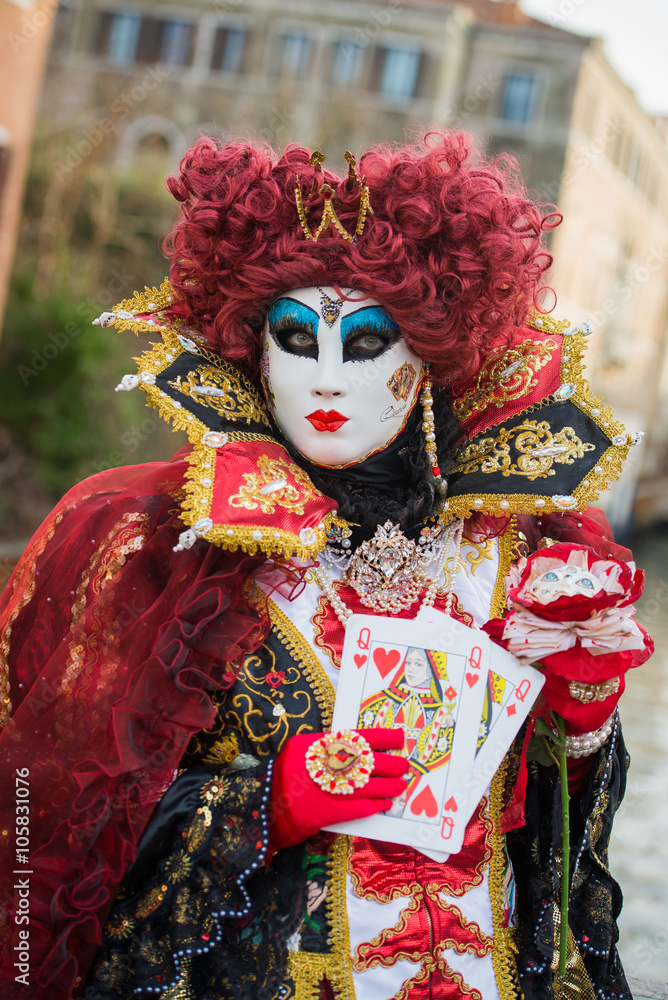 Venice - February 6, 2016: Colourful carnival mask through the streets of  Venice and in St. Mark's Square during celebration of the most famous carnival in the world. 