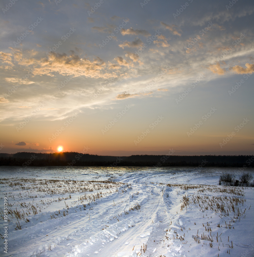 Winter road and sunset