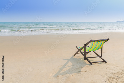 Beach chair on the sand ( feel lonely concept)