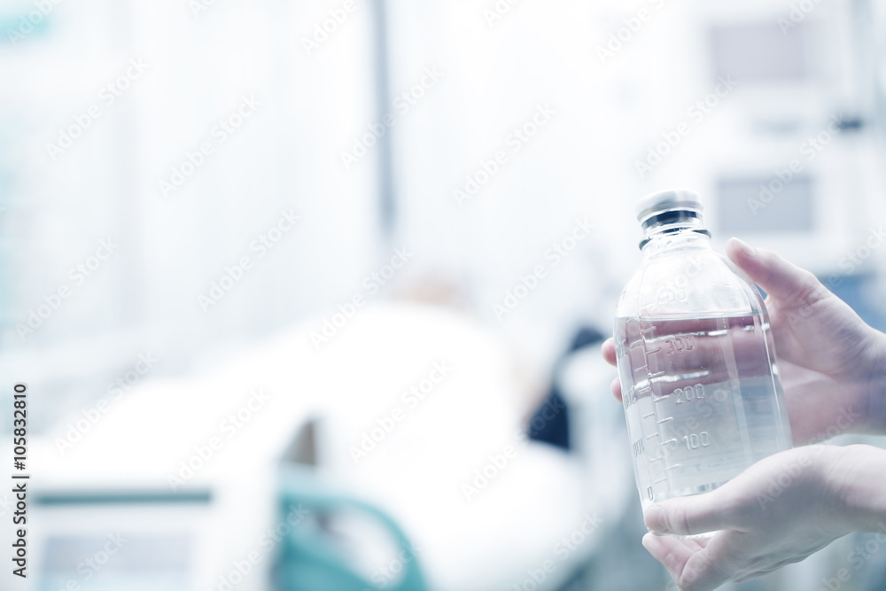 Medicinal bottle in nurses hands