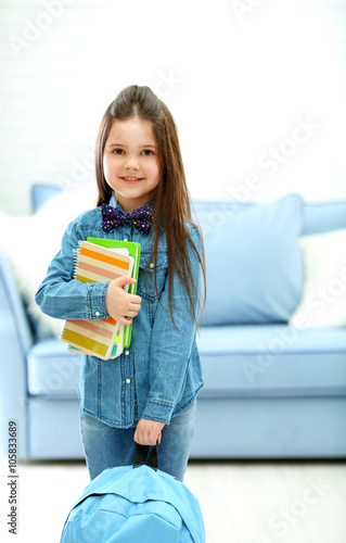 Little girl with blue back ...