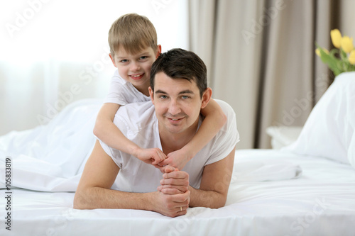 Portrait of son and father ...