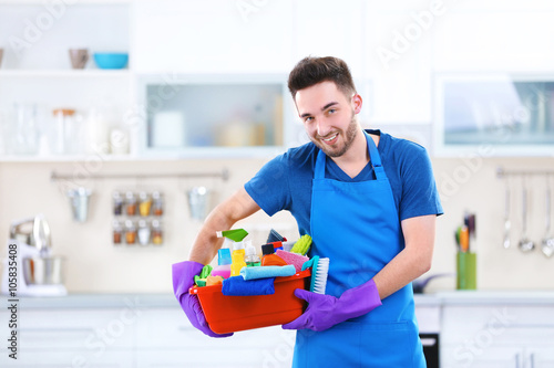 Man holding plastic basin w...