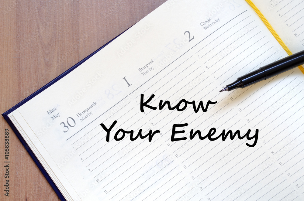 Know your enemy write on notebook