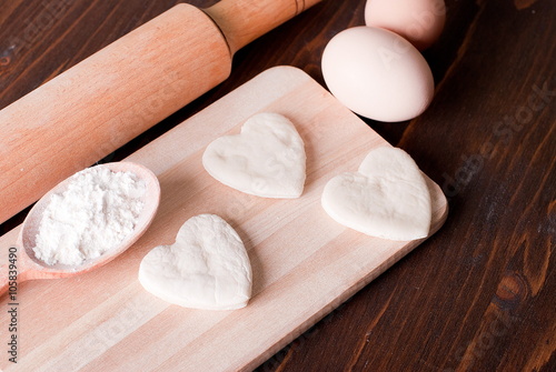 dough in the form of hearts on a cutting board