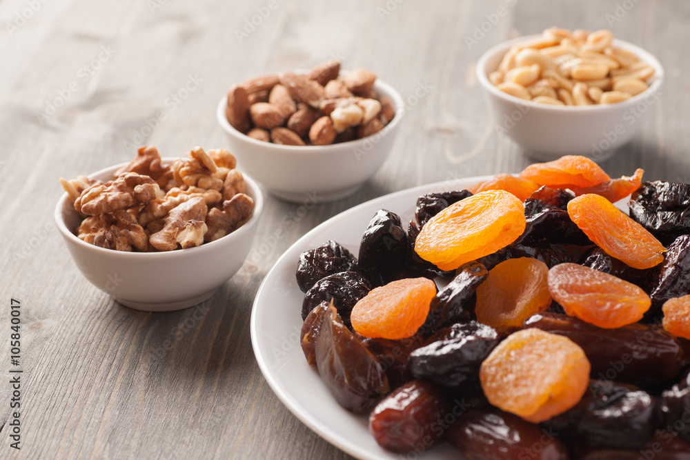 Dried fruits in a white plate with nuts Dried fruits in a white plate with nuts