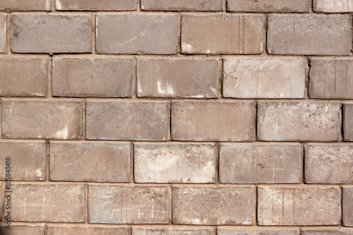 Gray concrete wall made of blocks, texture
