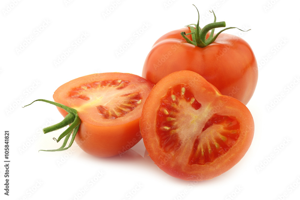 fresh tomato and a cut one on a white background fresh tomato and a cut one on a white background