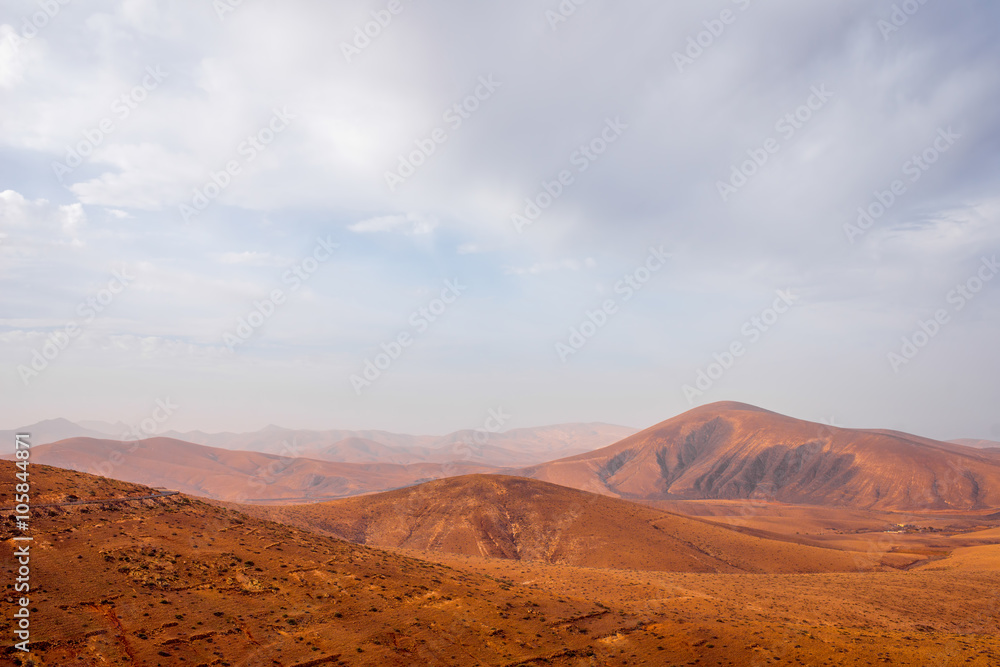 Mountain landscape at the central part of Fuerteventura island on the cloudy and foggy weather in Spain