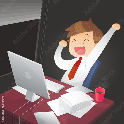 Young successful businessman in the office at night