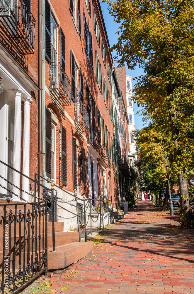 Fototapeta premium Red Brick Sidewalk lined with Terrace Houses on a Clear Autumn Day