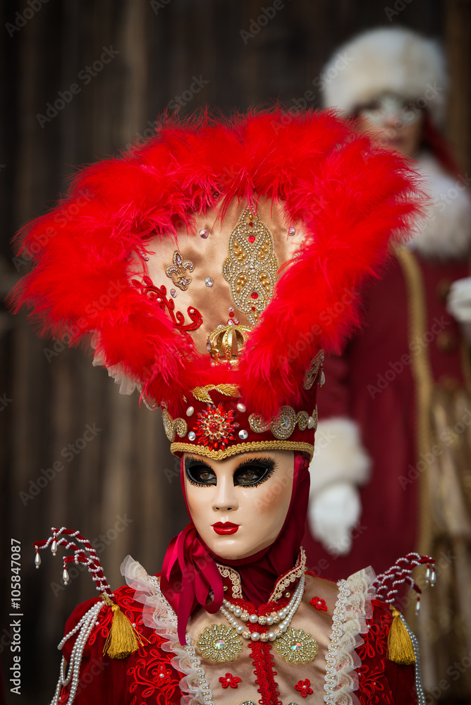 Venice - February 6, 2016: Colourful carnival mask through the streets of Venice and in St. Mark's Square during celebration of the most famous carnival in the world. Venice - February 6, 2016: Colourful carnival mask through the streets of Venice and in St. Mark's Square during celebration of the most famous carnival in the world.