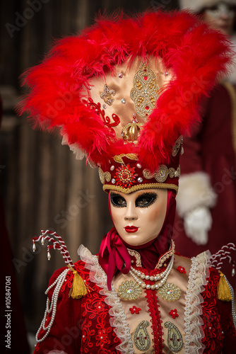 Fototapeta Naklejka Na Ścianę i Meble -  Venice - February 6, 2016: Colourful carnival mask through the streets of  Venice and in St. Mark's Square during celebration of the most famous carnival in the world. 