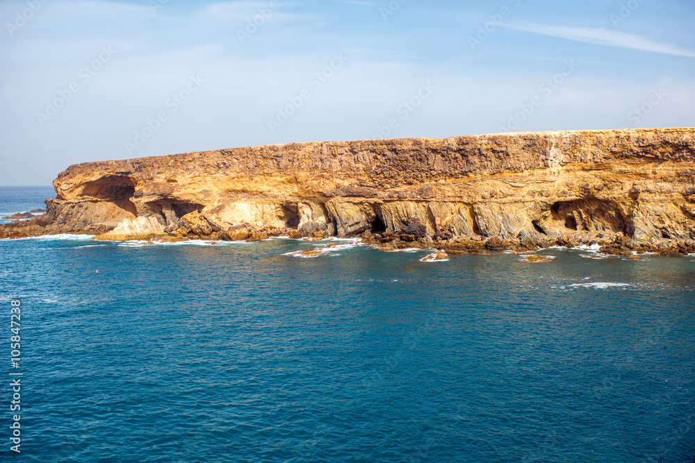 Black volcanic caves on the coast near Ajuy village on Fuerteventura island in Spain Black volcanic caves on the coast near Ajuy village on Fuerteventura island in Spain