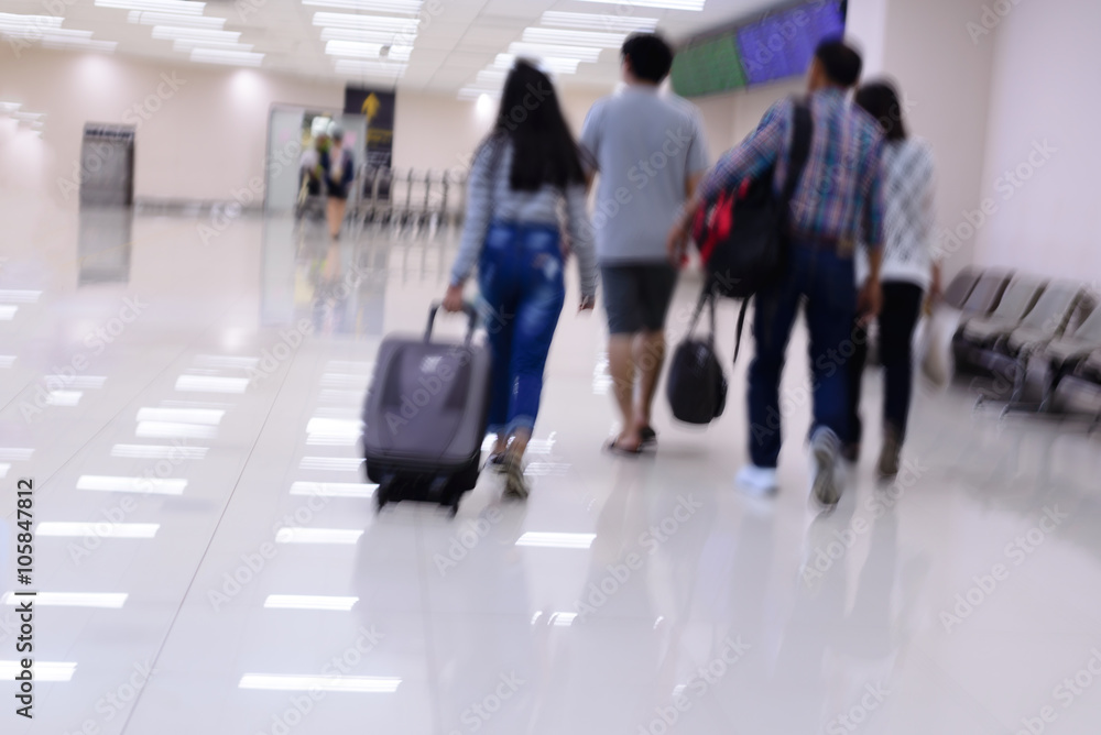 Blurred of family are walking in airport lounge. Blurred of family are walking in airport lounge.
